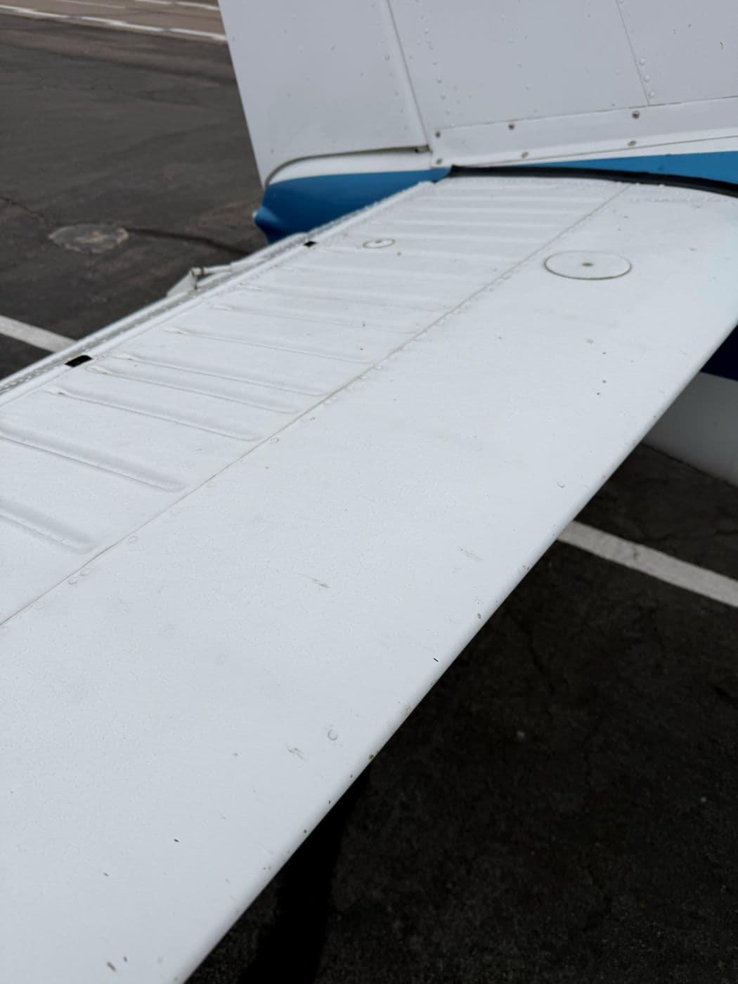 Grime along the trailing edge of the wing