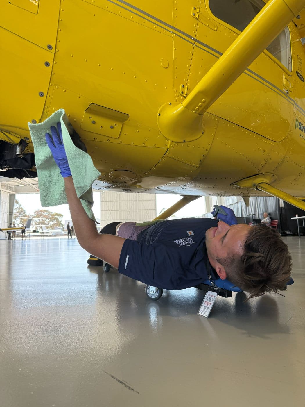 Jack wiping down the underside of the wing by hand