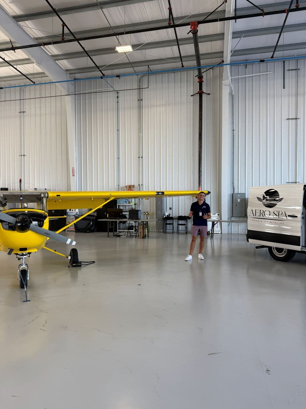 Jack with Yellowbird and the Aero Spa van in the hangar